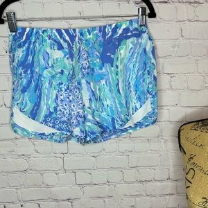 Lily Pulitzer sports shorts, size small and colors are different blues.